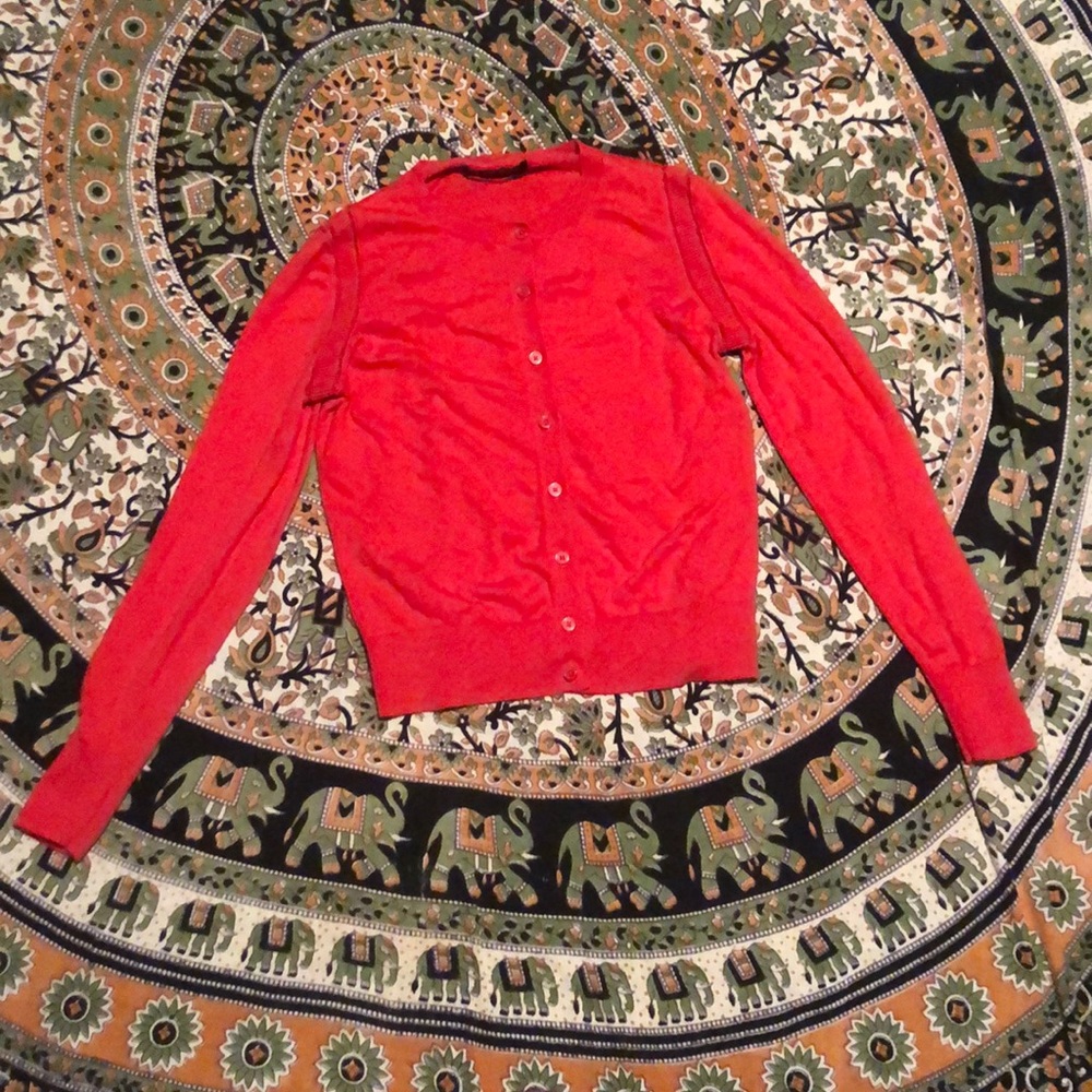 Red orange cardigan.